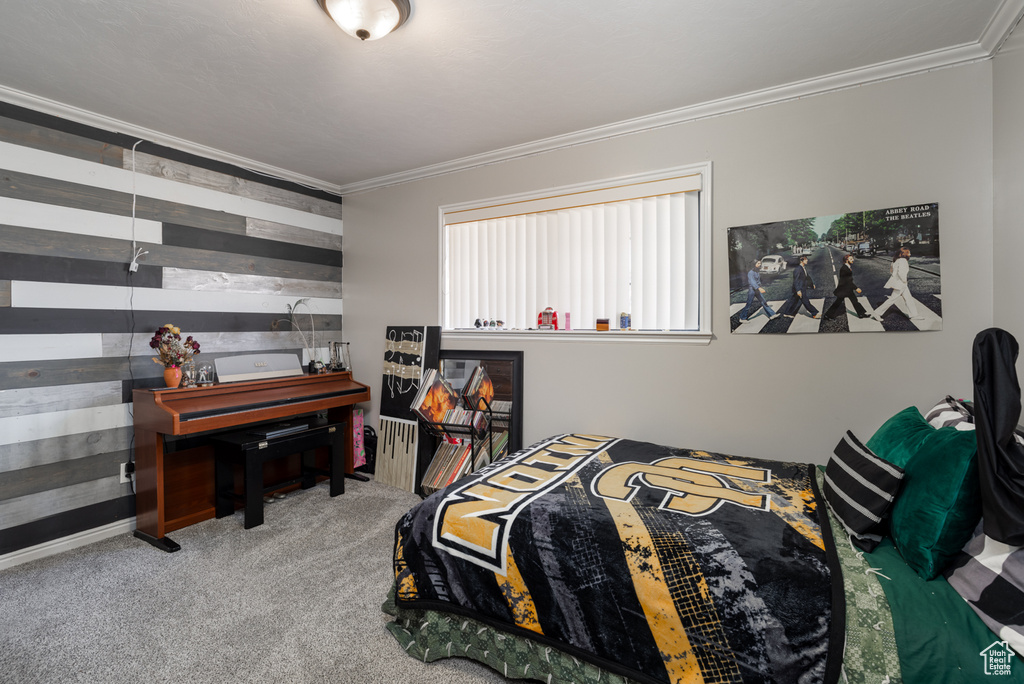 Carpeted bedroom featuring ornamental molding