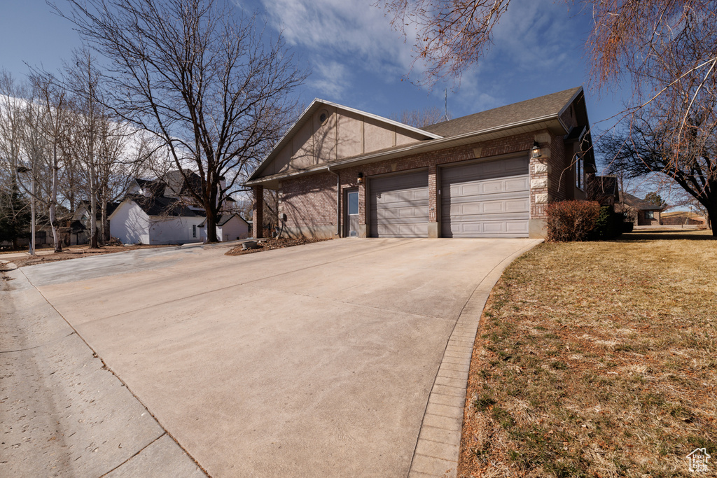 View of front of property featuring a garage