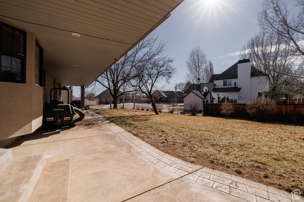 View of yard with a carport