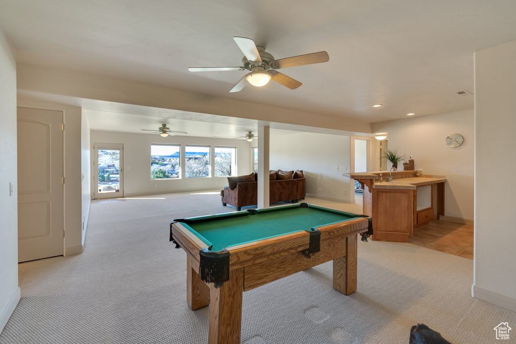 Playroom featuring light colored carpet, pool table, and ceiling fan