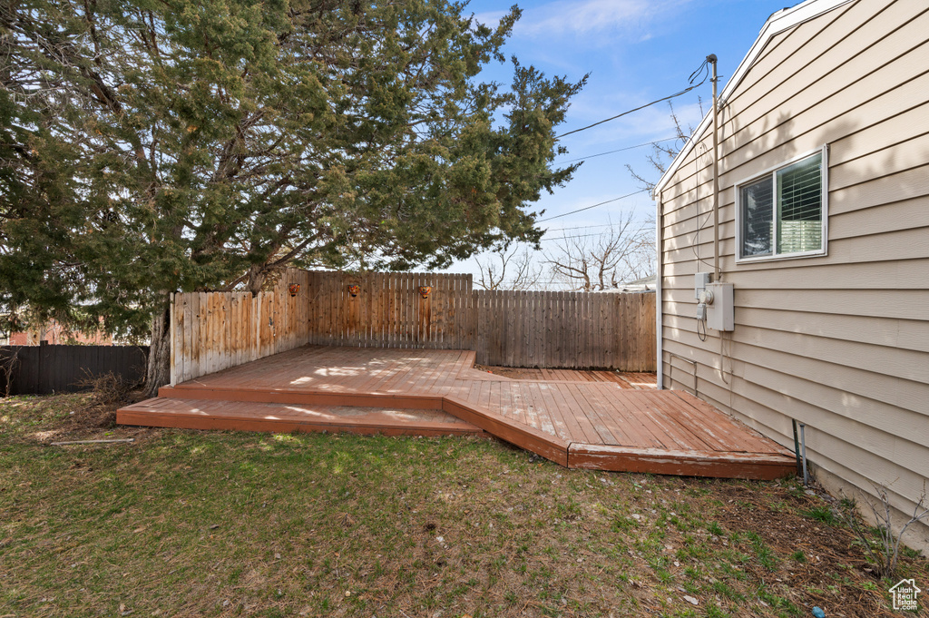 View of yard with a wooden deck