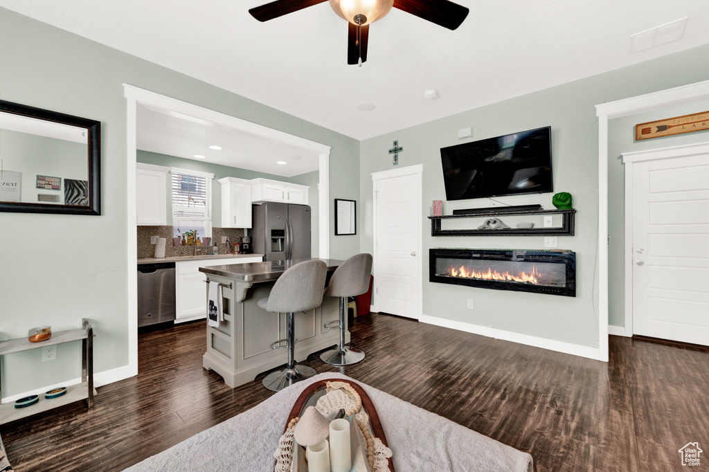 Interior space featuring dark hardwood / wood-style flooring and ceiling fan