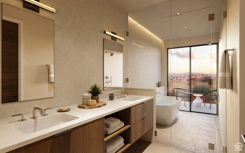 Bathroom featuring tile walls, double sink vanity, and tile flooring