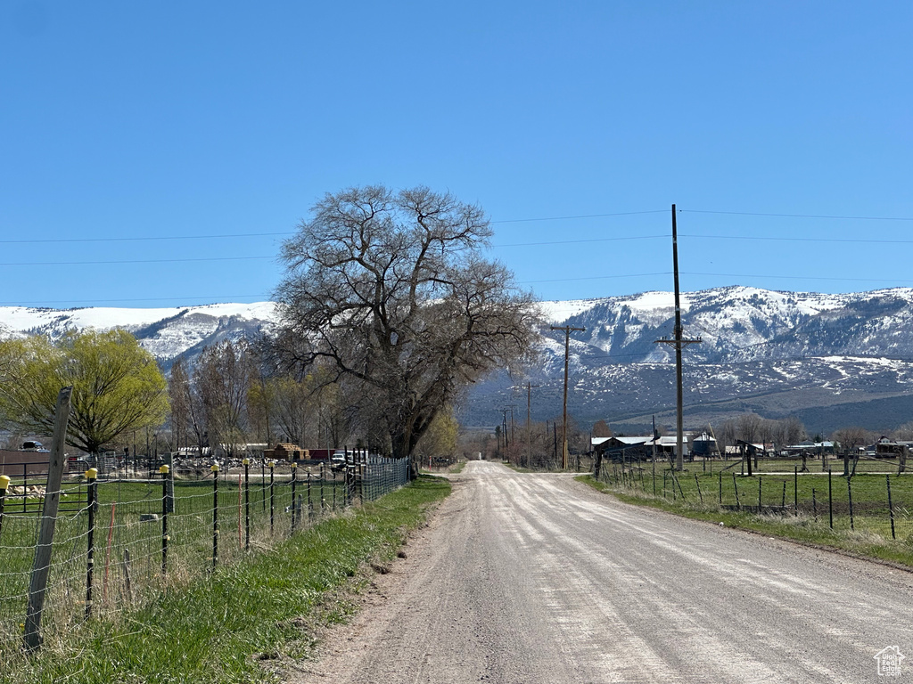 View of street with a mountain view and a rural view