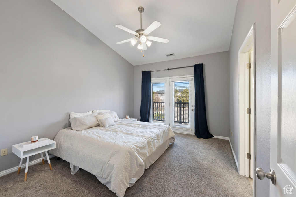 Bedroom featuring ceiling fan, light colored carpet, access to outside, and lofted ceiling