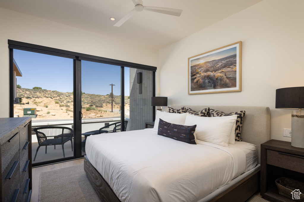 Bedroom with access to outside, wood finished floors, ceiling fan, and recessed lighting
