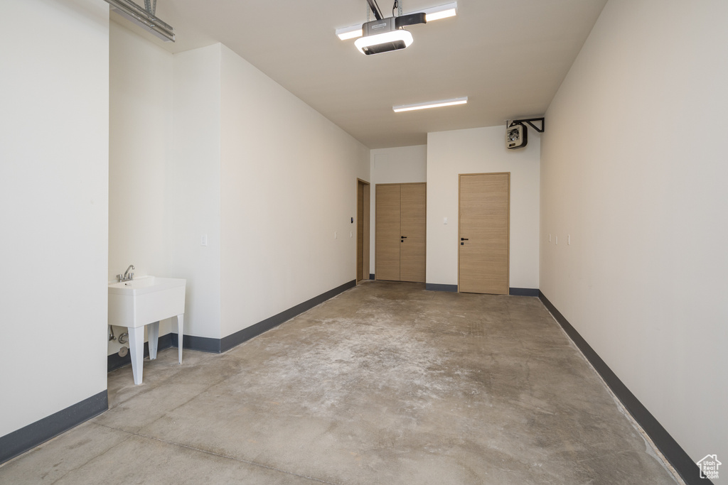 Garage featuring baseboards