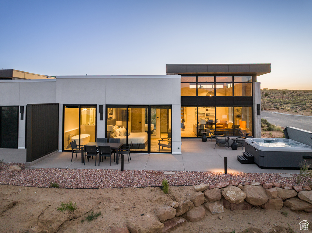 Back of property with a patio and outdoor dining space