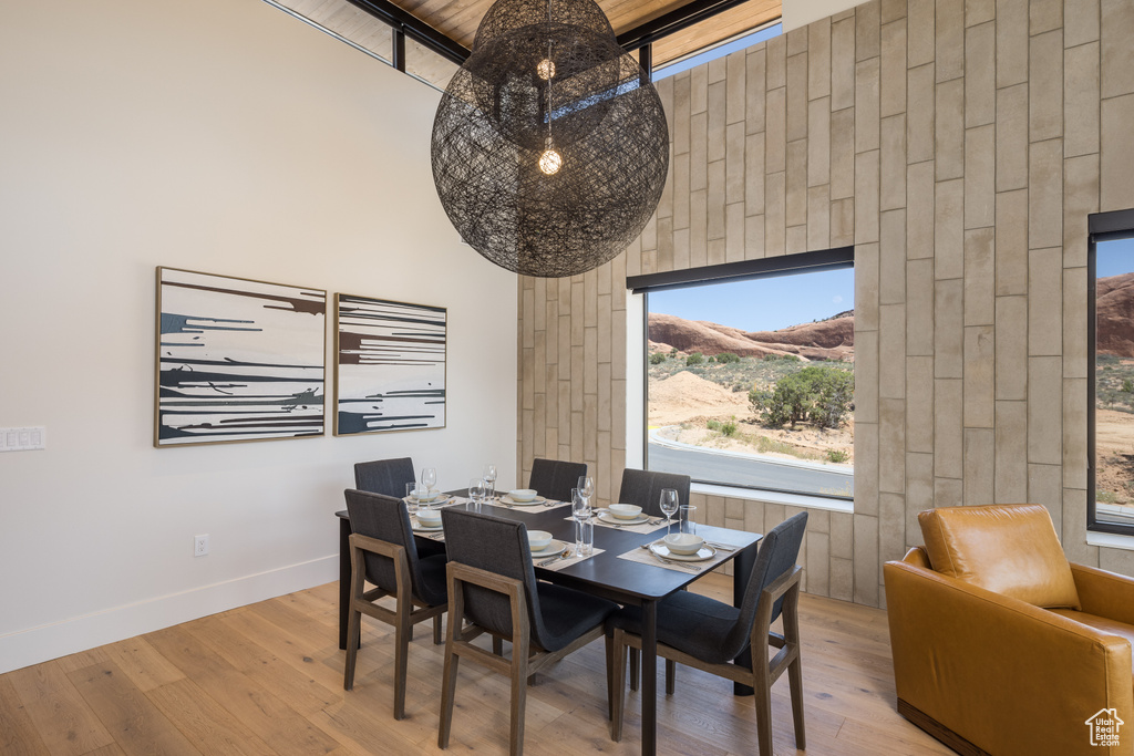 Dining room featuring wood finished floors and healthy amount of natural light