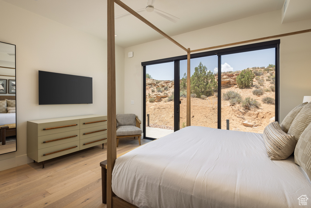 Bedroom with access to outside, light wood-type flooring, and ceiling fan