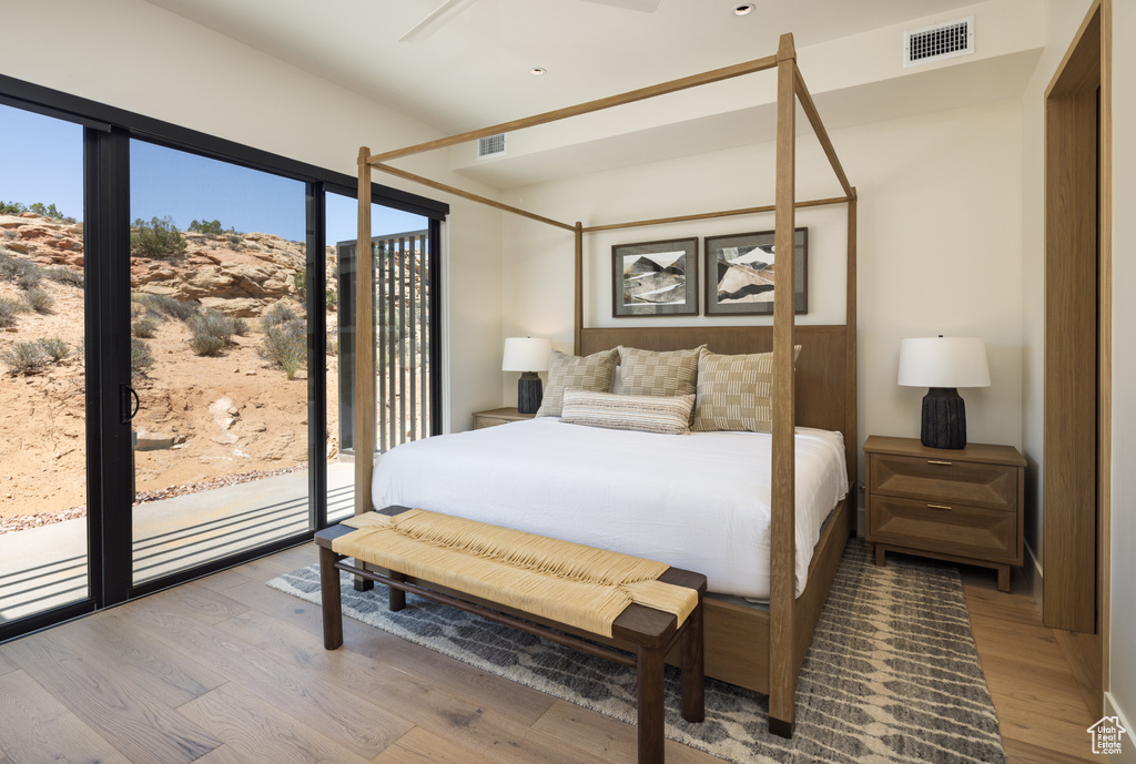 Bedroom with light wood finished floors and access to exterior