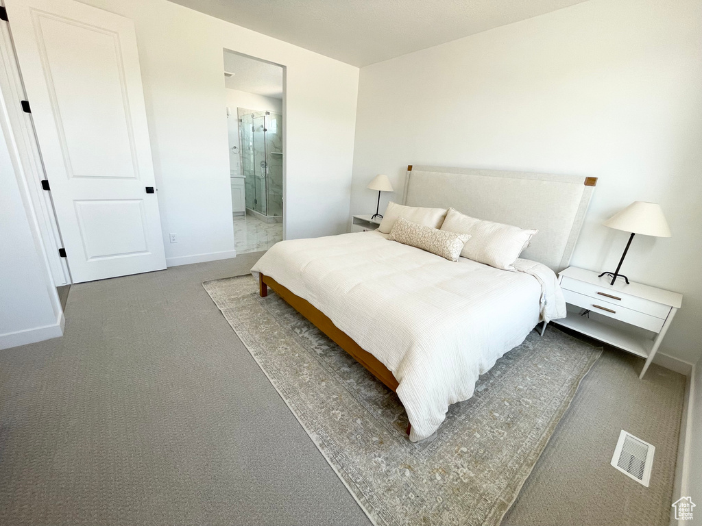 Bedroom featuring carpet and connected bathroom