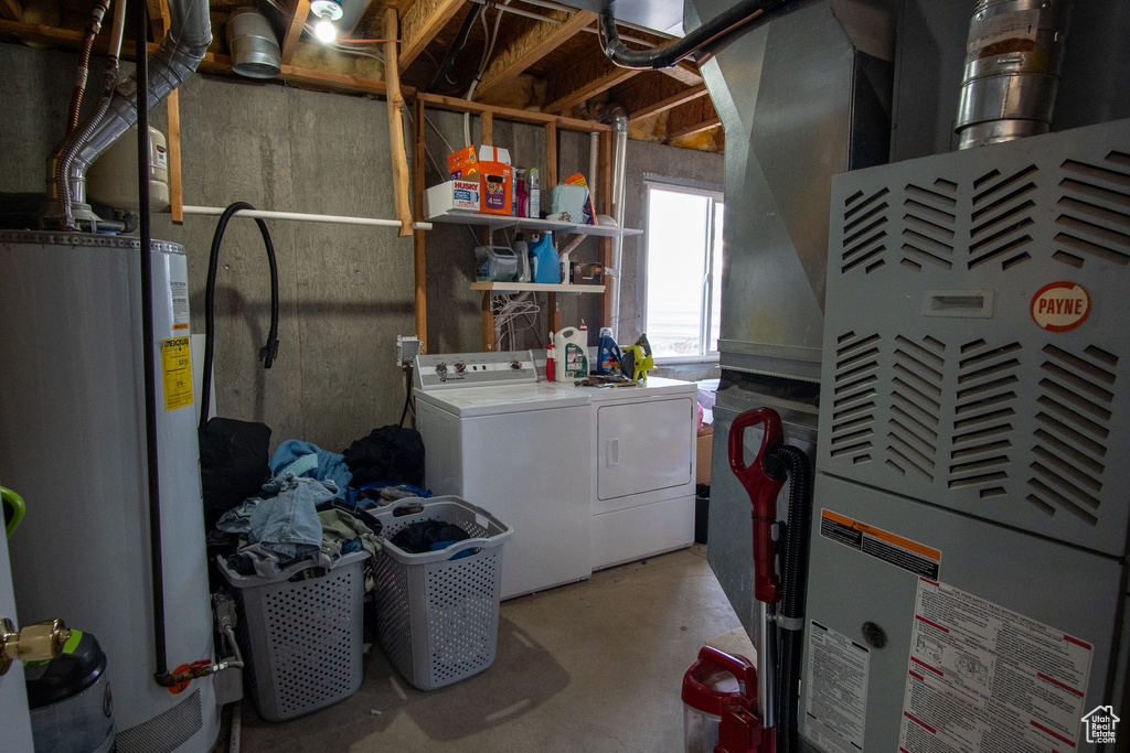 Basement featuring separate washer and dryer and gas water heater