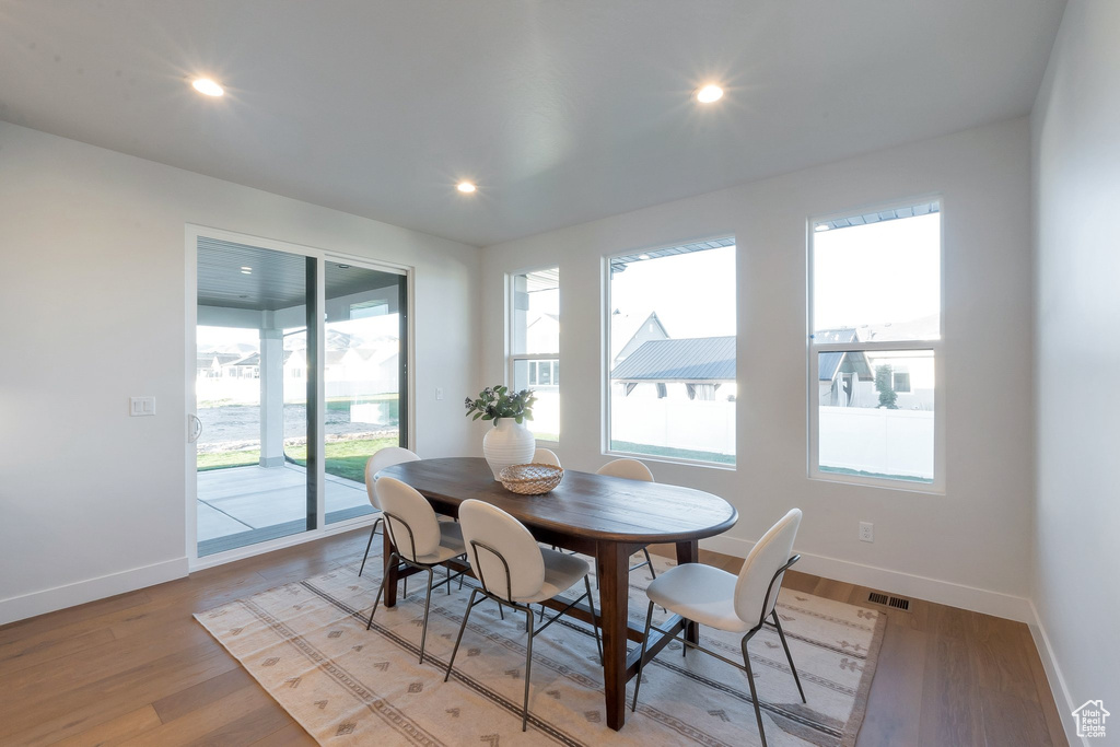 Dining area featuring light hardwood / wood-style floors and a wealth of natural light