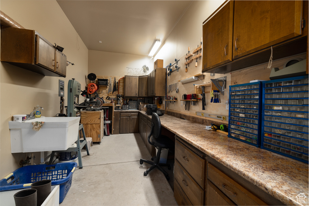 Home office featuring a workshop area and sink