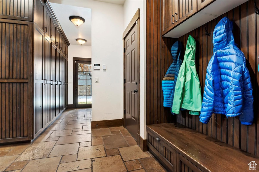 Mudroom with light tile flooring