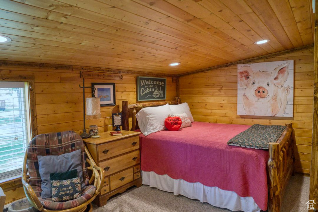 Bedroom with wood ceiling, carpet, and vaulted ceiling
