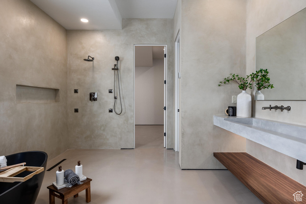 Bathroom with concrete flooring