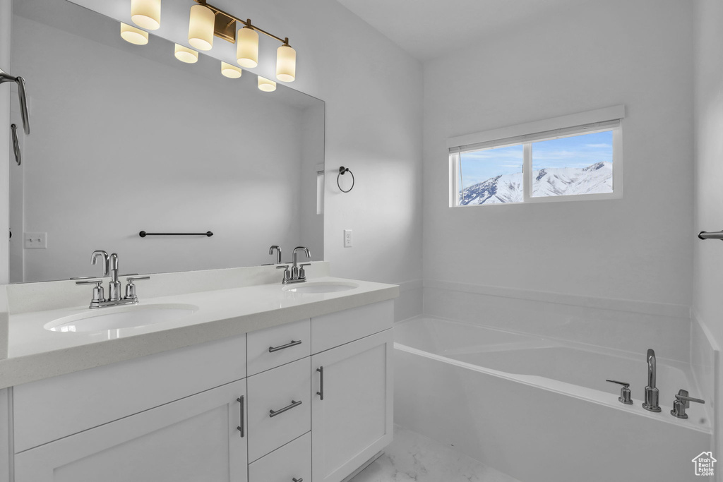Bathroom with a tub and double vanity