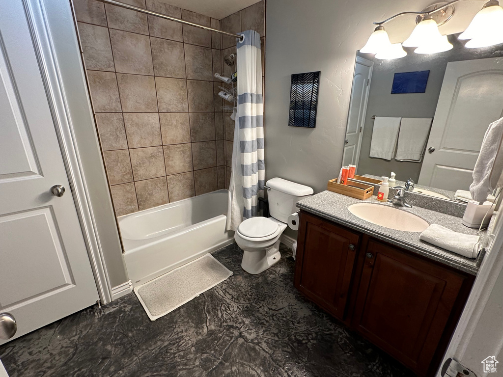 Full bathroom with vanity, toilet, tile flooring, and shower / tub combo with curtain