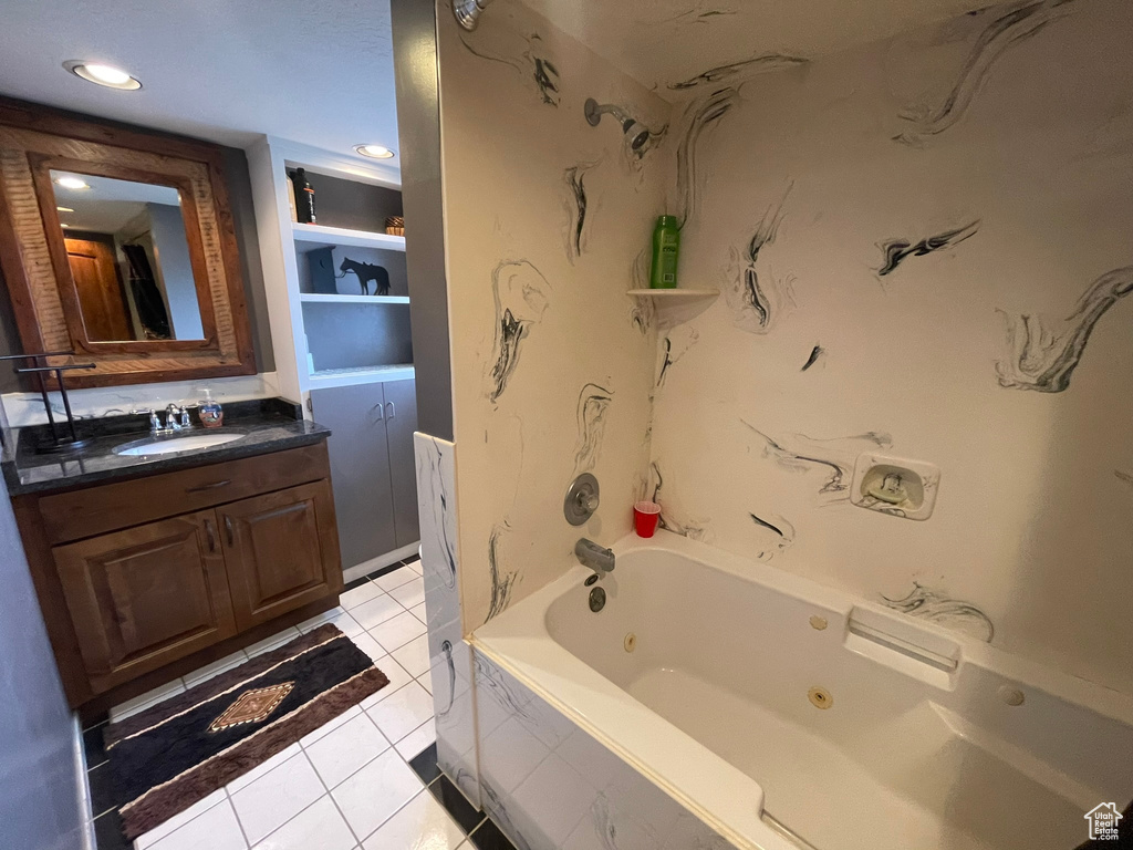 Bathroom featuring vanity, tile flooring, and shower / bathtub combination