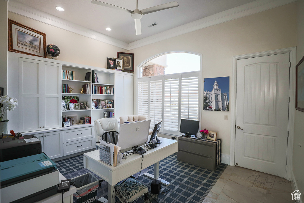 Tiled home office featuring ornamental molding and ceiling fan