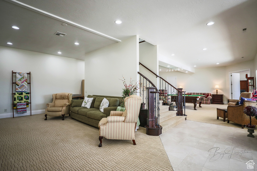 Living room featuring light tile flooring and pool table