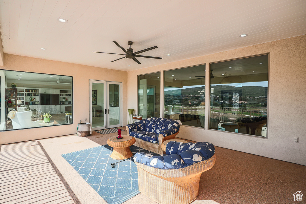 View of patio / terrace featuring an outdoor hangout area, french doors, and ceiling fan