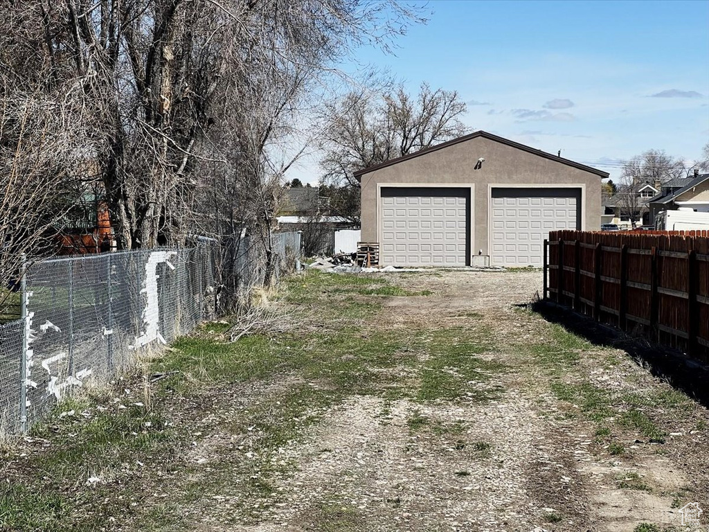 View of yard featuring a garage