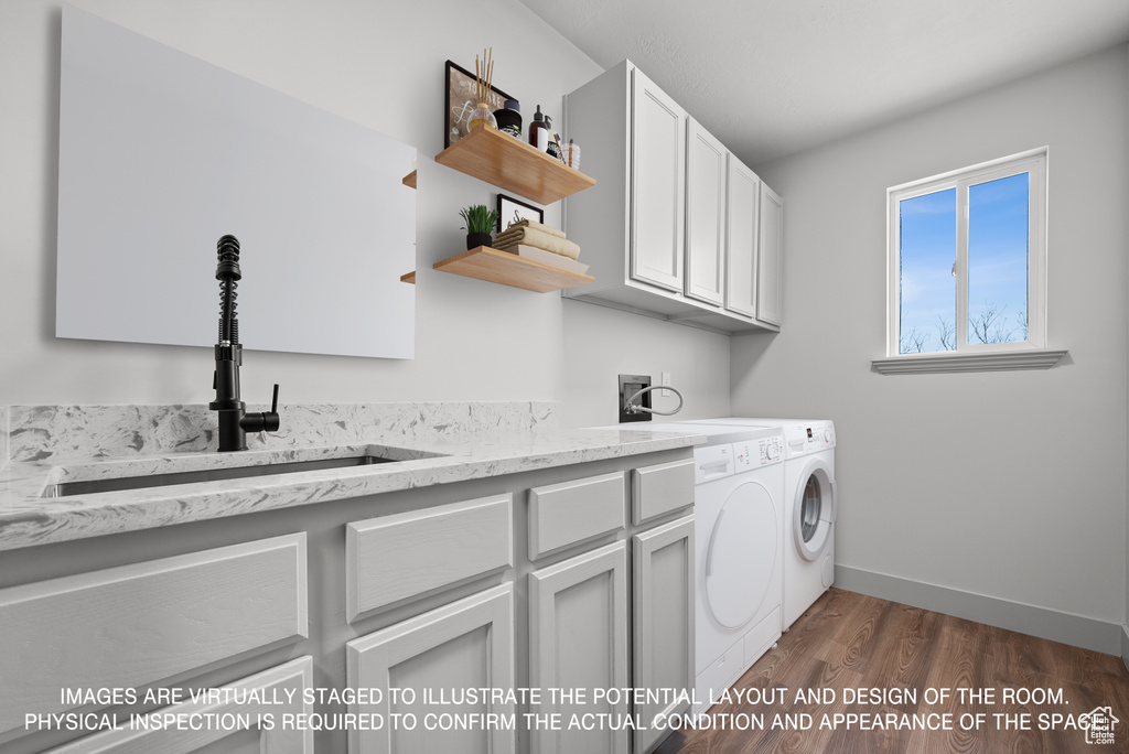 Washroom featuring independent washer and dryer, sink, cabinets, and dark hardwood / wood-style floors