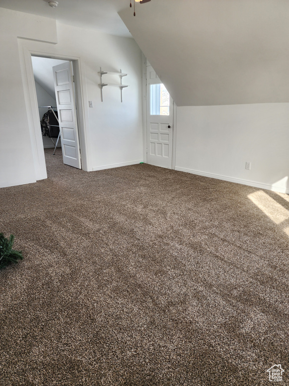 Bonus room with carpet floors and lofted ceiling