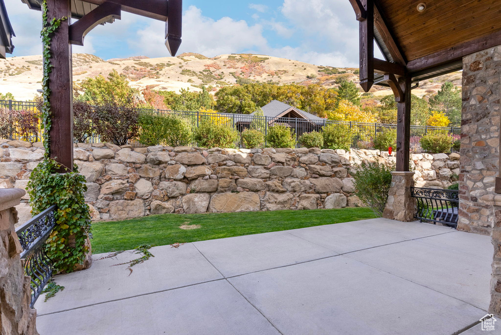 View of patio / terrace with a mountain view