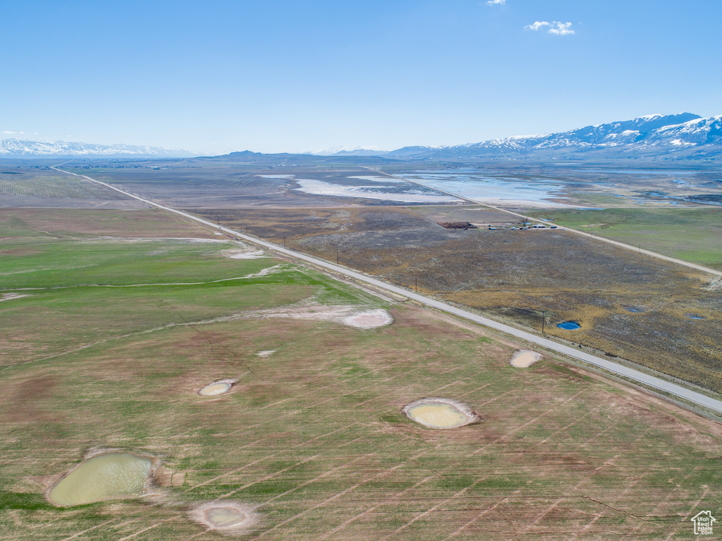 Drone / aerial view with a water and mountain view