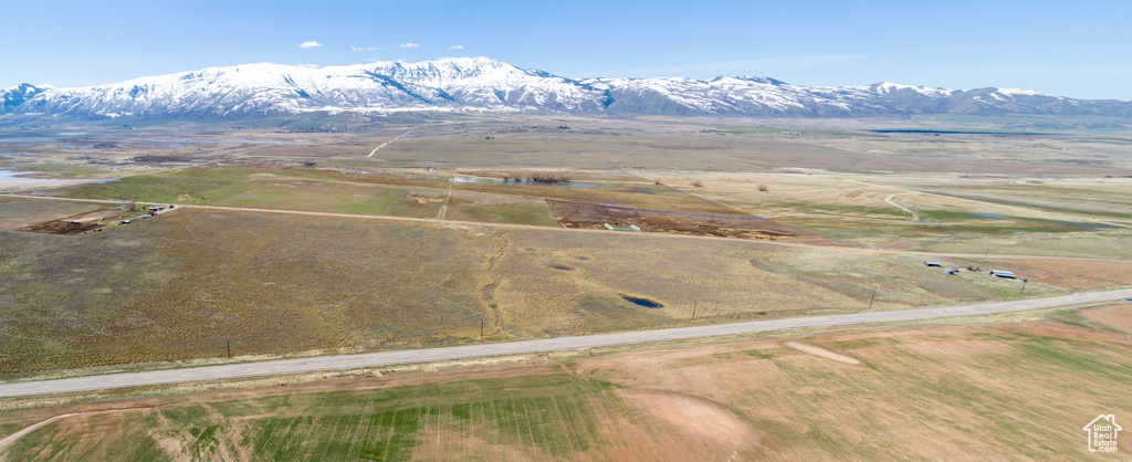 Aerial view featuring a rural view and a mountain view