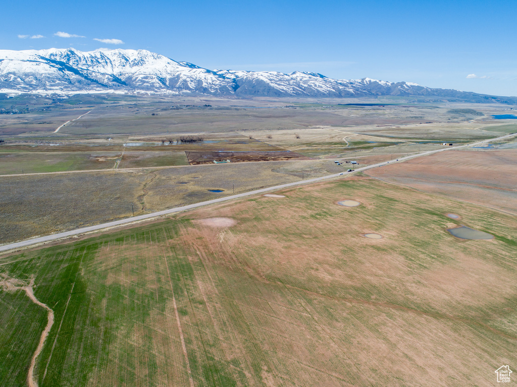 Birds eye view of property with a mountain view and a rural view