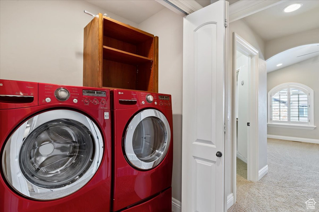 Laundry area with independent washer and dryer and light carpet