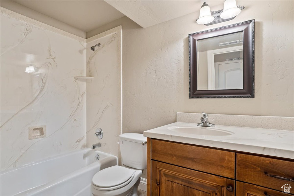 Full bathroom with  shower combination, toilet, and vanity
