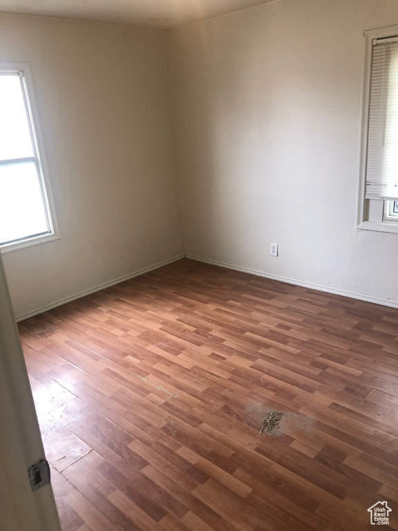 Spare room with hardwood / wood-style flooring