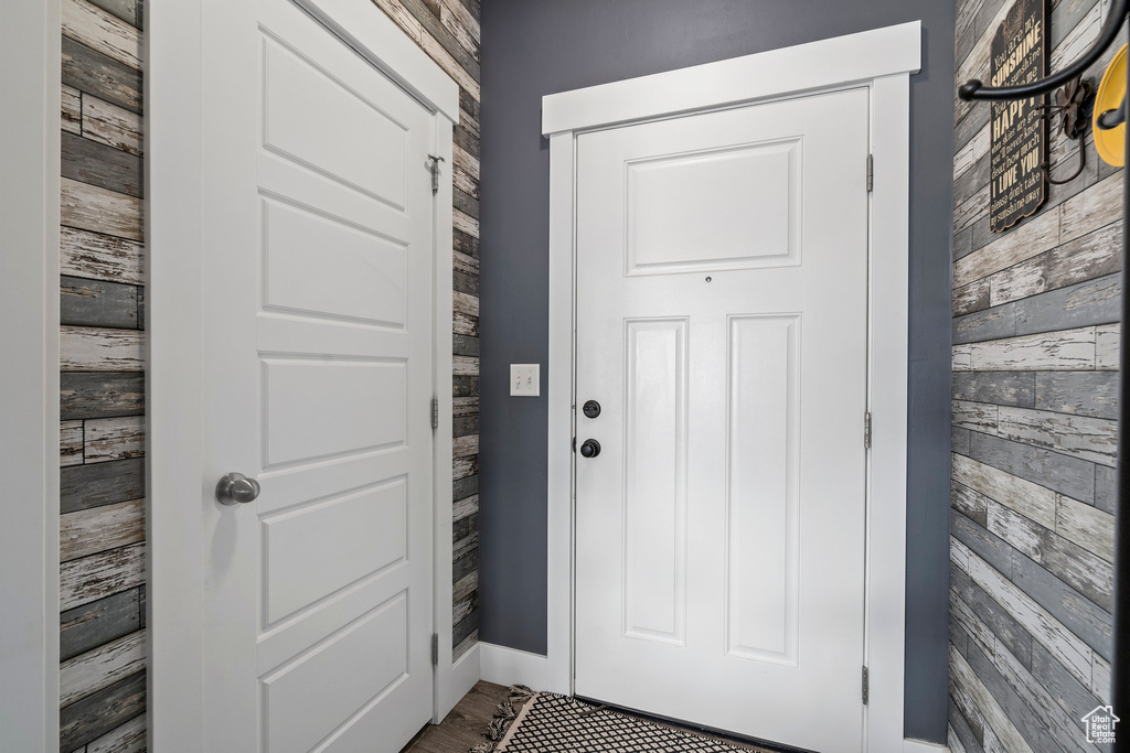 Entryway with dark hardwood / wood-style floors
