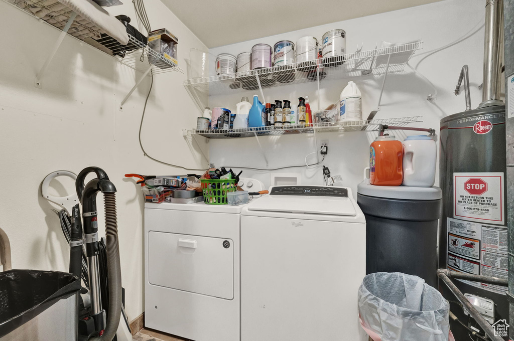 Washroom featuring washer and dryer, gas water heater, and hookup for a washing machine