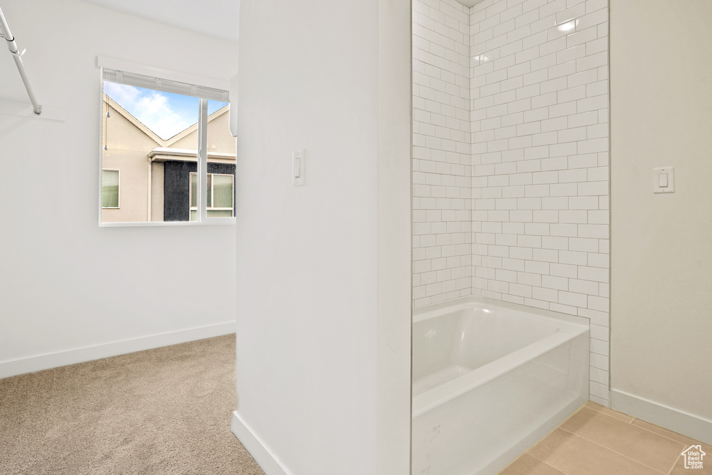 Bathroom with tile floors and tiled shower / bath