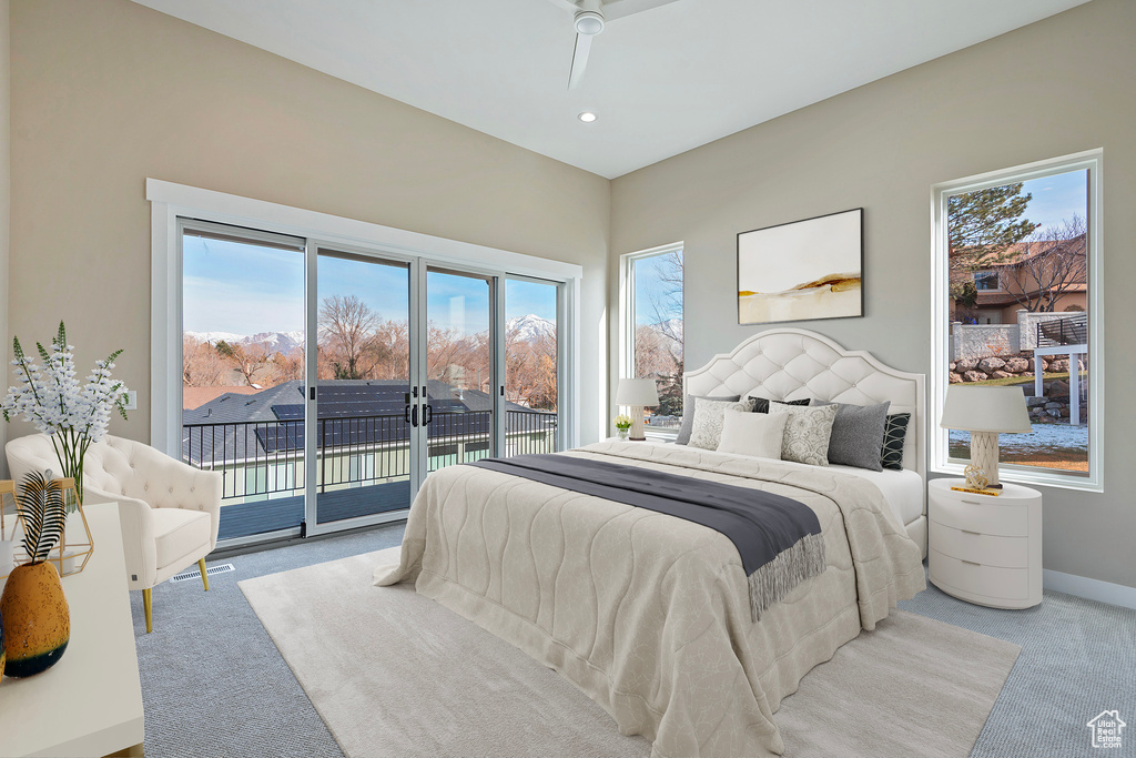 Bedroom with access to exterior, light carpet, and ceiling fan