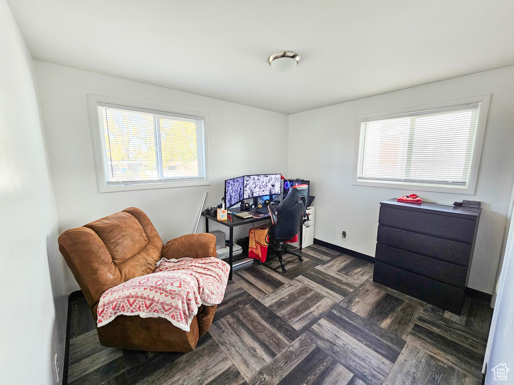 Living area with dark parquet flooring