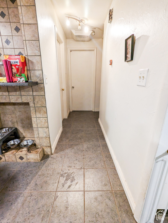 Hallway with tile floors