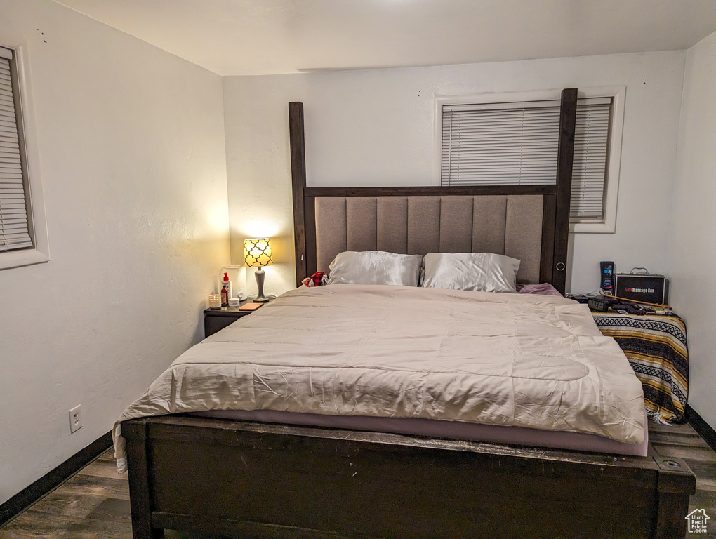 Bedroom featuring dark hardwood / wood-style floors