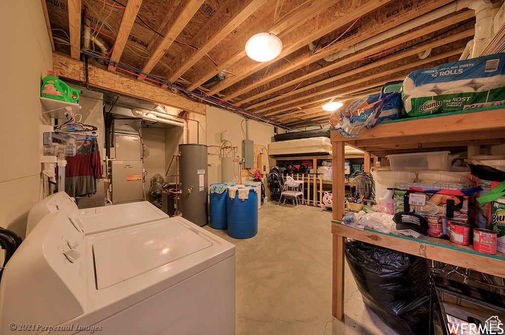 Basement with water heater and washing machine and dryer
