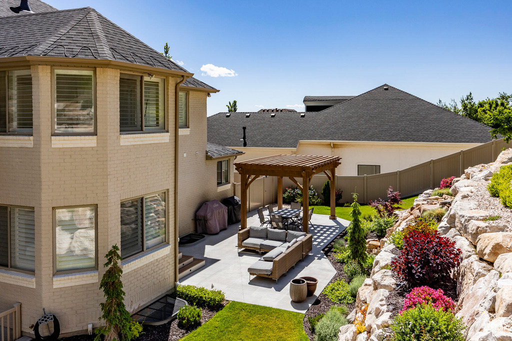 Exterior space with a pergola and an outdoor hangout area