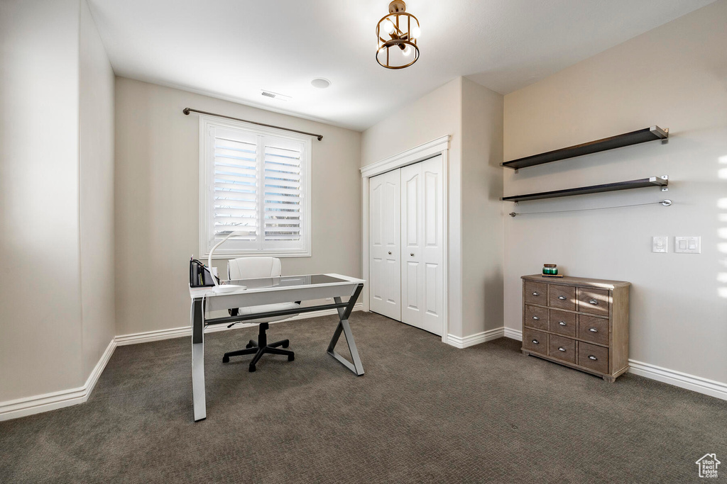 Office with dark colored carpet