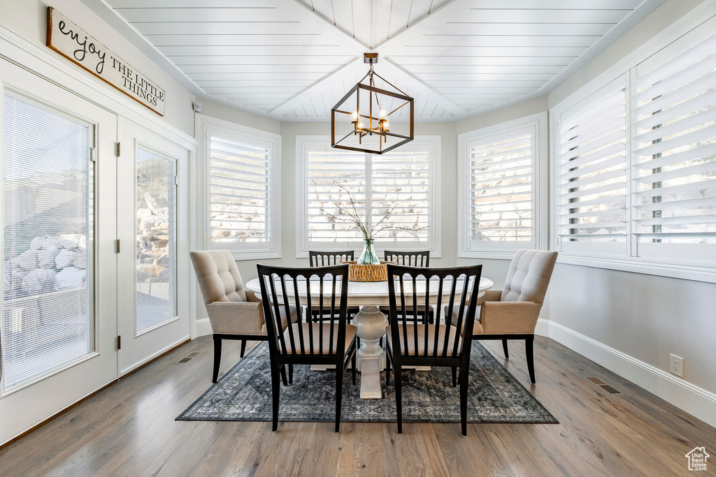 Sunroom / solarium with a chandelier