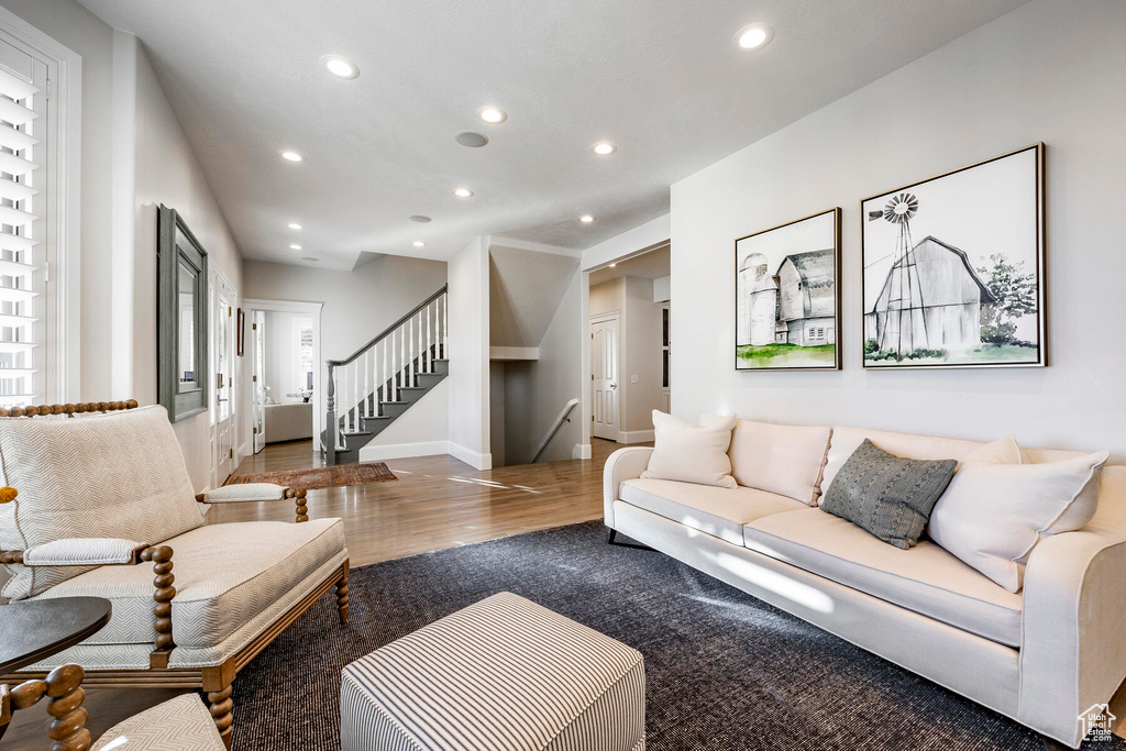 Living room with hardwood / wood-style flooring